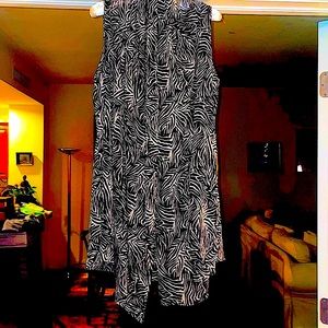 Light airy sleeveless tunic-length topper